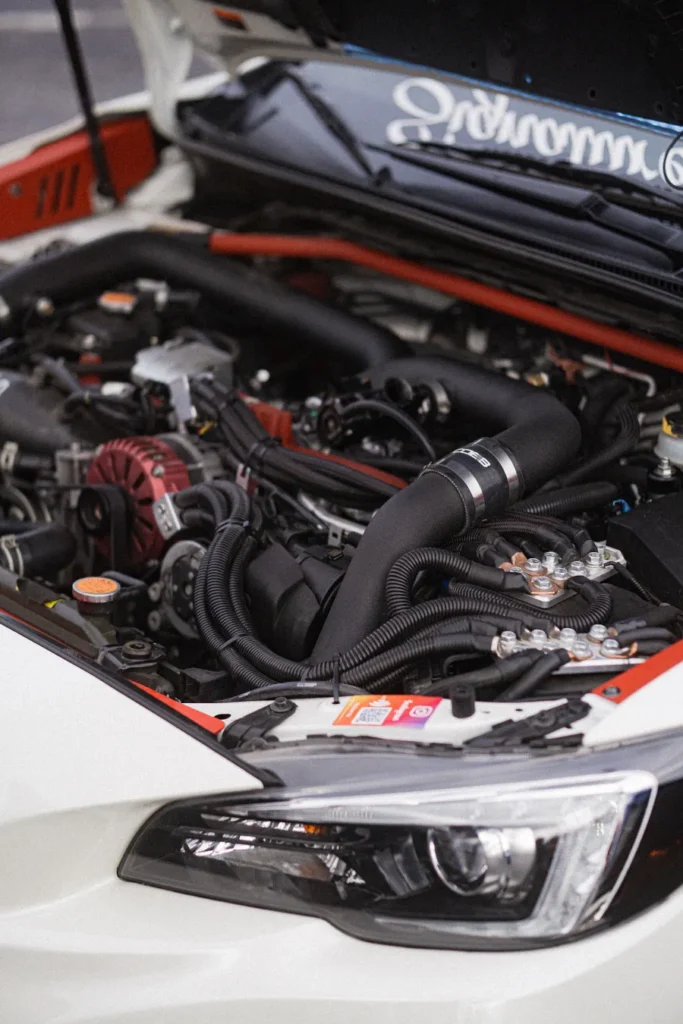 Open hood showing a car engine bay